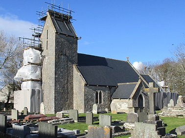 The church with scaffolding on the tower